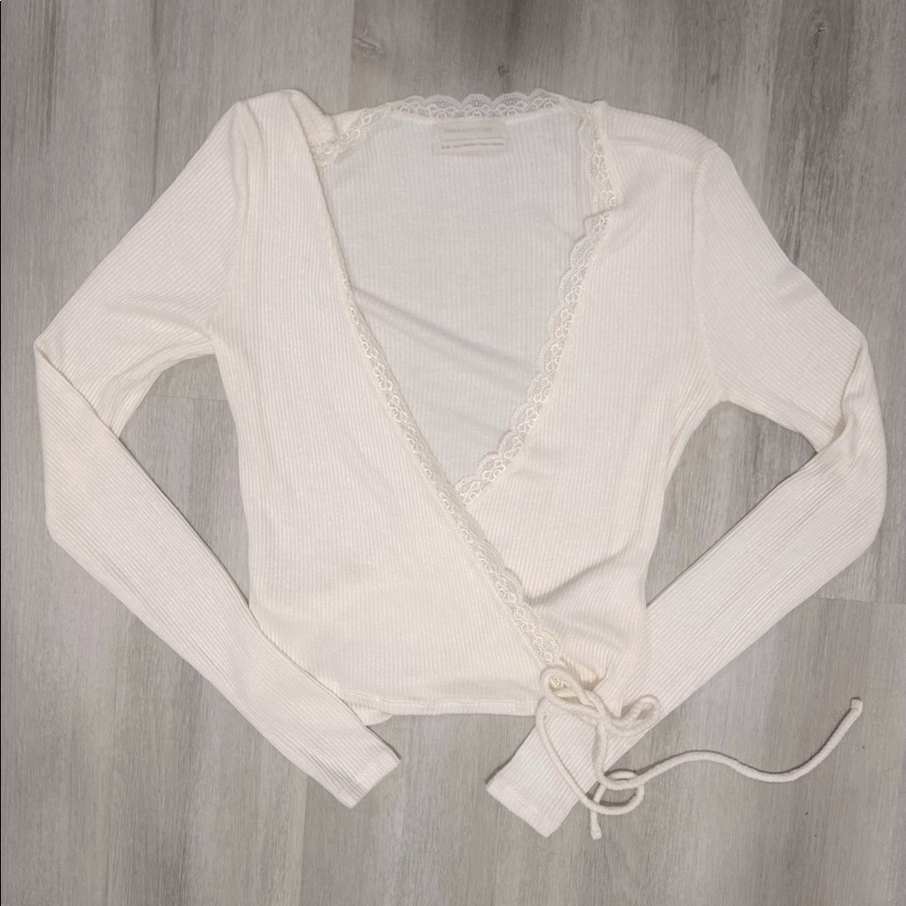 This is a Urban Outfitters tie sweater/shirt, it has been worn once.